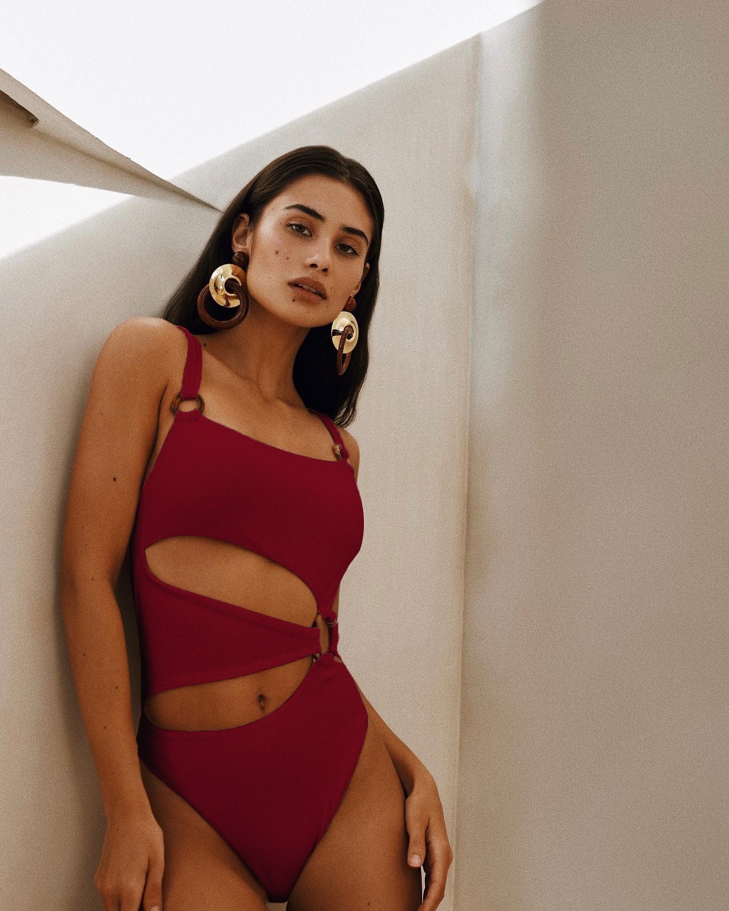 One piece swimsuit with tight fitting solid color bikini